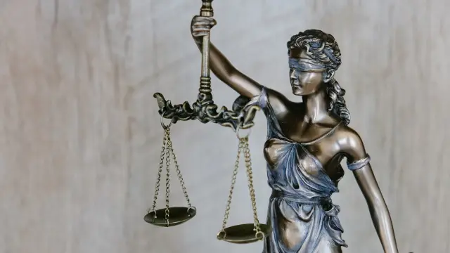 Legal compliance documents and scales of justice